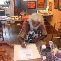 Getting my beautiful aboriginal painting signed by the famous Jim 'Boonga' Edwards in Kuranda.